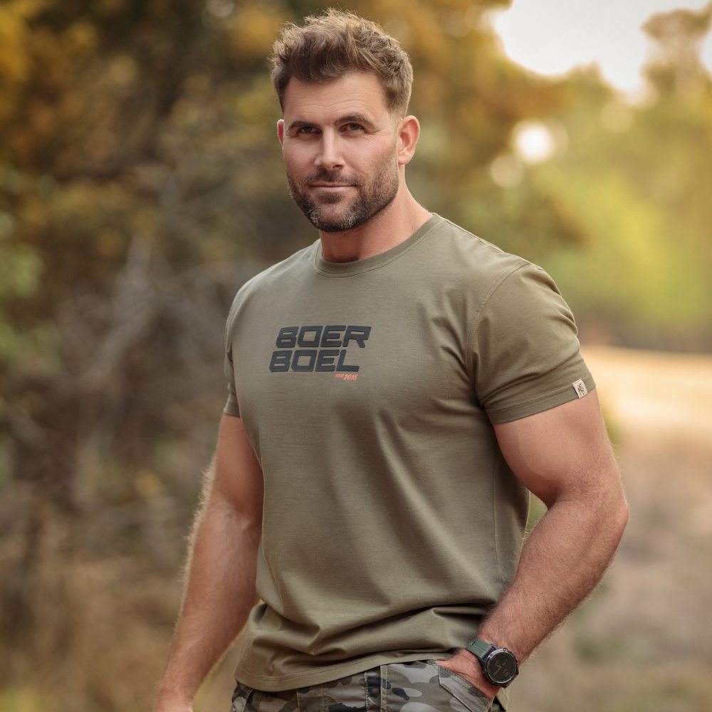 Man wearing army green Boerboel t-shirt outdoors showing contemporary fit and comfortable styling